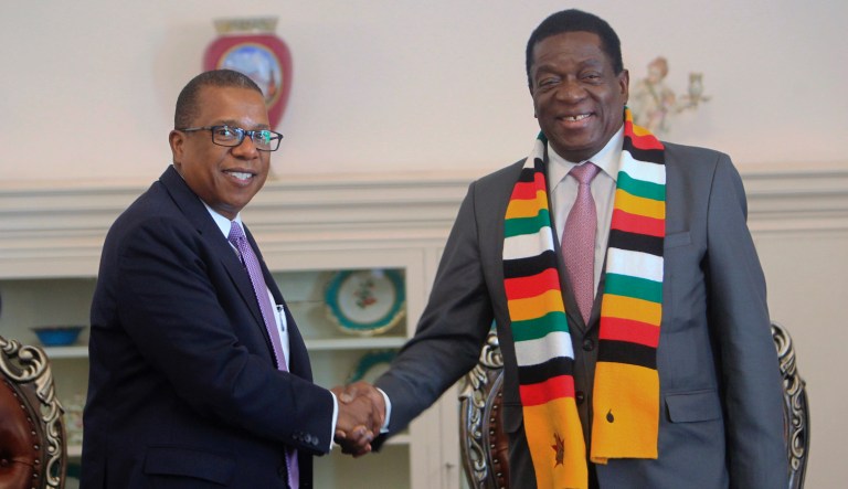 Ambassador to Zimbabwe Brian Nichols, left, is seen with Zimbabwean President-elect Emmerson Mnangagwa.