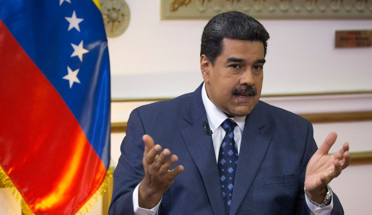 Venezuela's President Nicolas Maduro speaks during an interview with The Associated Press at Miraflores presidential palace in Caracas, Venezuela, Thursday, Feb. 14, 2019.