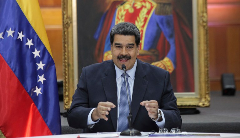 Venezuela's President Nicolas Maduro holds a press conference with foreign media at Miraflores presidential palace where an image of Venezuelan independence hero Simon Bolivar is displayed in Caracas, Venezuela, Wednesday, Jan. 9, 2019. Maduro will be sworn-in for a second, six-year term on Thursday.