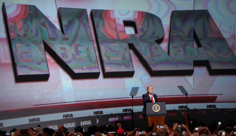 In this April 28, 2017 file photo, President Donald Trump speaks during the National Rifle Association-ILA Leadership Forum, in Atlanta. As NRA prepares to gather for its 147th annual meeting in Dallas, the political landscape has changed considerably in the past year.