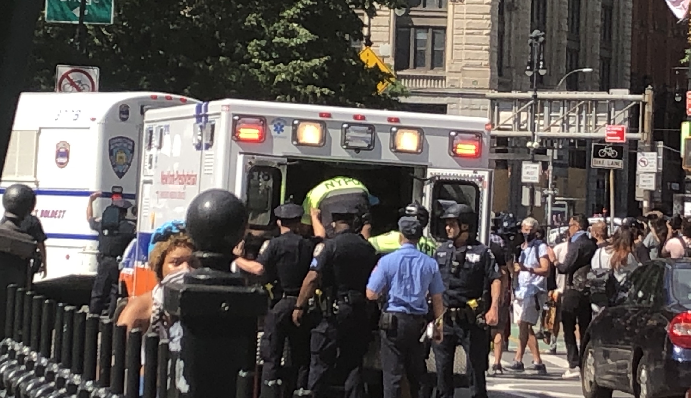 An injured New York Police Department officer is loaded into an emergency vehicle.