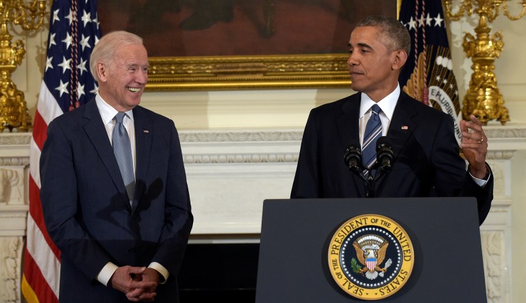 President Barack Obama, right, honors Vice President Joe Biden, left, during a ceremony in the State Dining Room of the White House in Washington, Thursday, Jan. 12, 2017.