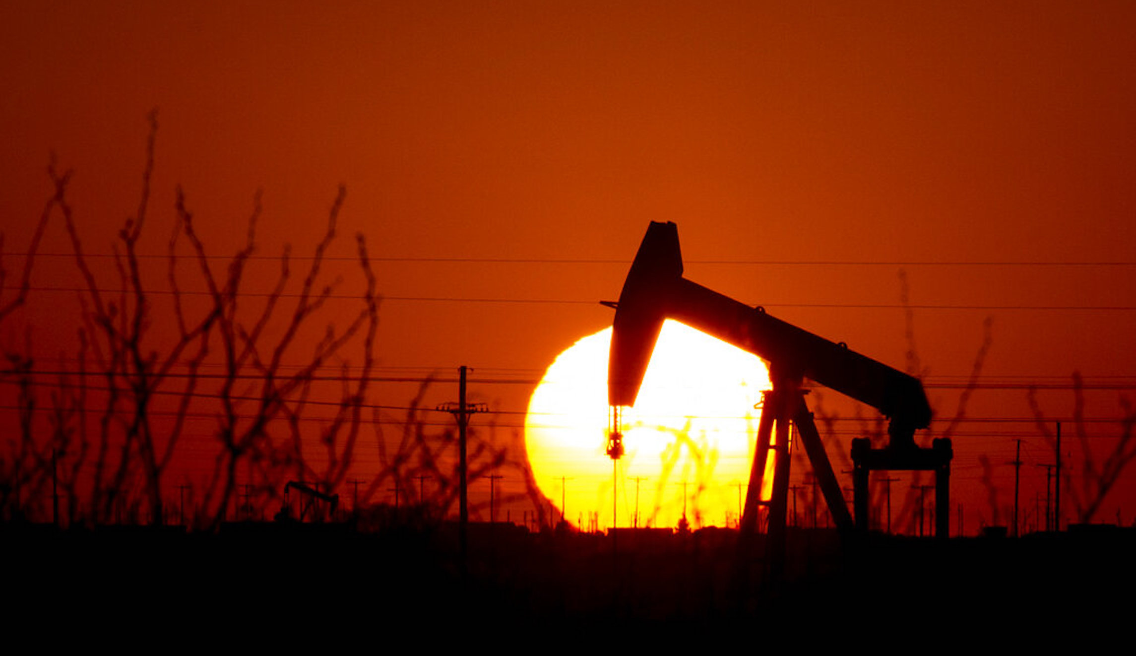 Oil tumbles below $100 a barrel, down 25% from peak