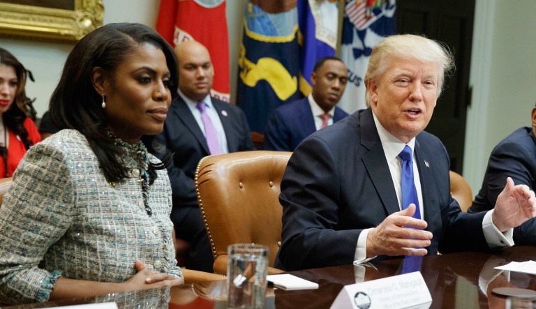 FILE - In this Feb. 1, 2017, file photo, President Donald Trump speaks during a meeting on African American History Month in the Roosevelt Room of the White House in Washington. From left are, Omarosa Manigault, Trump, and then-Housing and Urban Development Secretary-designate Ben Carson. Omarosa Manigault Newman â the former "Apprentice" contestant who became one of Trump's most prominent African -American supporters â has resigned from the White House.