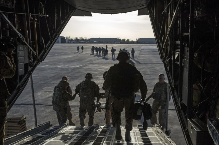 U.S. Army Soldiers from the 82nd Airborne Division leave a C-130H Hercules as they arrive in Iraq to support Operation Inherent Resolve, Feb. 6, 2015. 