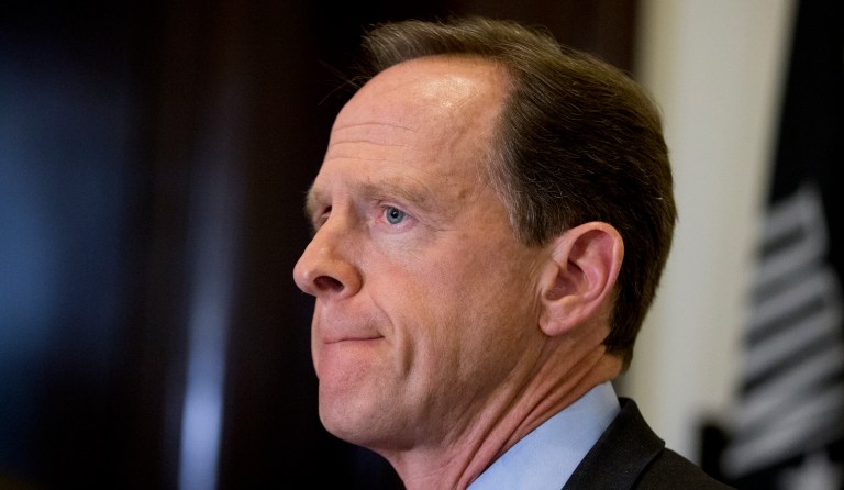 Sen. Pat Toomey, R-Pa., speaks during a ceremony to award World War II veteran Clarence Smoyer, 96, the Bronze Star at the World War II Memorial, Wednesday, Sept. 18, 2019, in Washington.