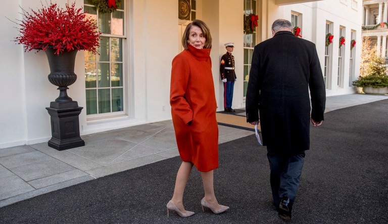 House Minority Leader Nancy Pelosi of Calif., left, speaks to a reporter as she and Senate Minority Leader Sen. Chuck Schumer of N.Y., right, walk back into the West Wing after speaking to members of the media outside of the White House in Washington, Tuesday, Dec. 11, 2018, following a meeting with President Donald Trump.