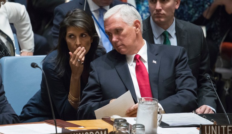 Ambassador to the United Nations Nikki Haley, left, whispers to Vice President Mike Pence during a high-level Security Council meeting.