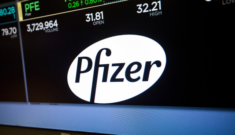 A monitor displays Pfizer Inc. signage on the floor of the New York Stock Exchange (NYSE) in New York, U.S., on Friday, June 9, 2017. 