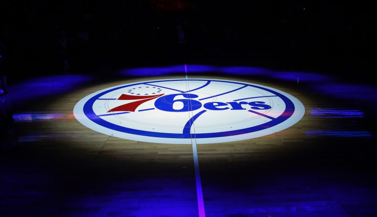 The Philadelphia 76ers' lhalf-court logo is shown before an NBA basketball game against the Cleveland Cavaliers, Friday, Nov. 8, 2013, in Philadelphia. 