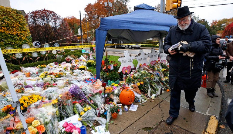 Rabbi Chuck Diamond arrives on the street corner outside the Tree of Life Synagogue Saturday, Nov. 3, 2018 in the Squirrel Hill neighborhood of Pittsburgh to lead a Shabbat morning service, a week after 11 people were killed and six wound when their worship was interrupted by a gunman's bullets on Saturday, Oct. 27, 2018.