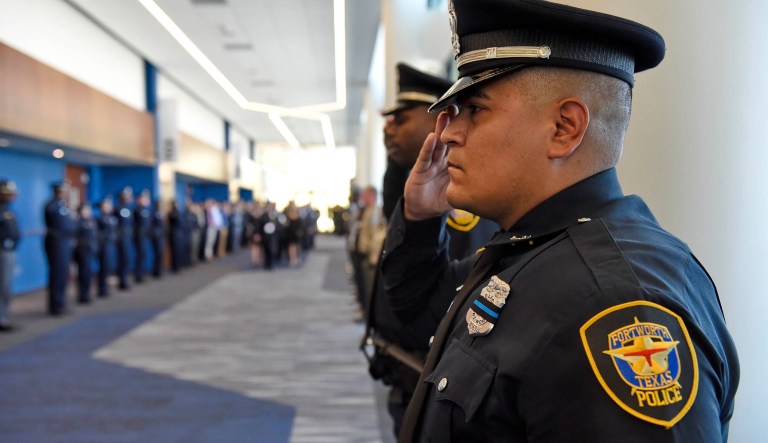 Police officers wearing masks, patrol in Central, a business district in Hong Kong, Wednesday, Feb. 19, 2020.