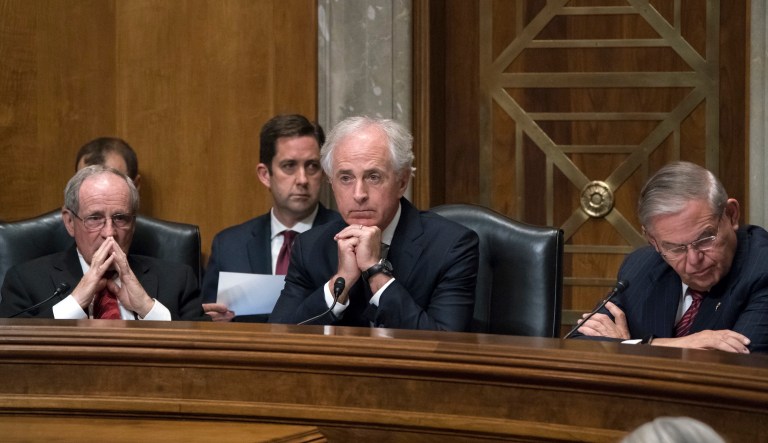 Senate Foreign Relations Committee Chairman Bob Corker, R-Tenn., flanked by Sen. Jim Risch, R-Idaho, and Sen. Bob Menendez, D-N.J., the ranking member, guides a confirmation vote on Capitol Hill, April 23, 2018.