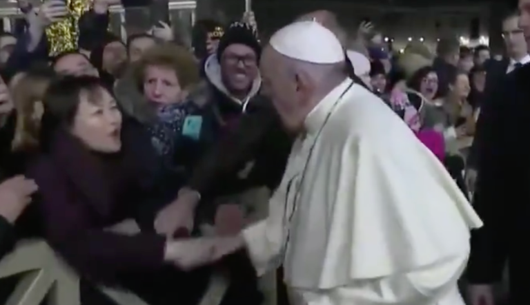 Pope Francis gets grabbed by supporter in Vatican City