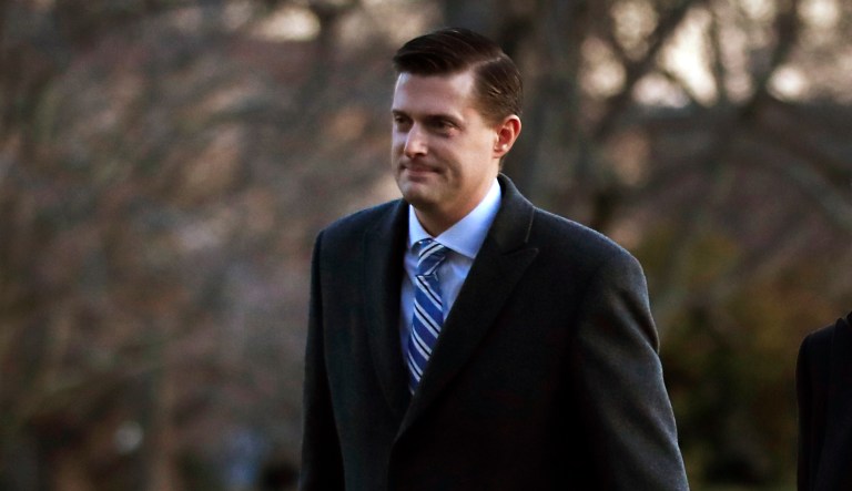 White House staff secretary Rob Porter, left, walks with White House senior adviser Stephen Miller from Marine One across the South Lawn of the White House in Washington, Monday, Feb. 5, 2018, as they return with President Donald Trump form Ohio.