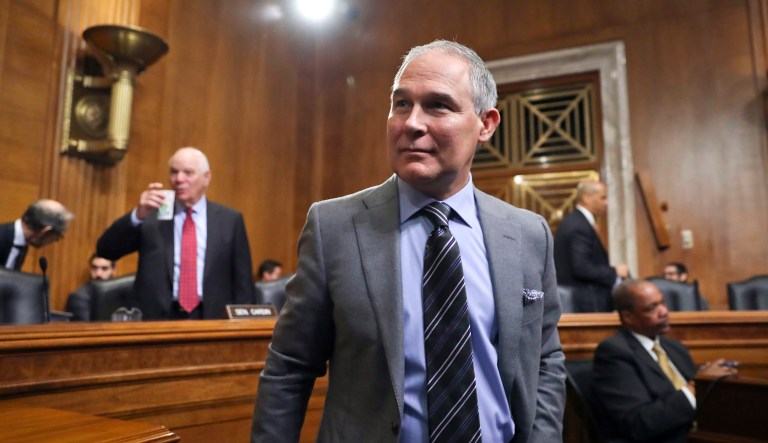 Environmental Protection Agency Administrator Scott Pruitt arrives to testify before the Senate Environment Committee on Capitol Hill in Washington, Tuesday, Jan. 30, 2018. Committee member Sen. Ben Cardin, D-Md., is on the left.