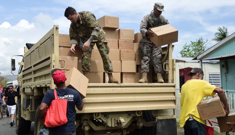 Soldiers and National Guard organize aid for the Santa Ana community in the aftermath of Hurricane Maria in Guayama, Puerto Rico, Thursday, Oct. 5, 2017.