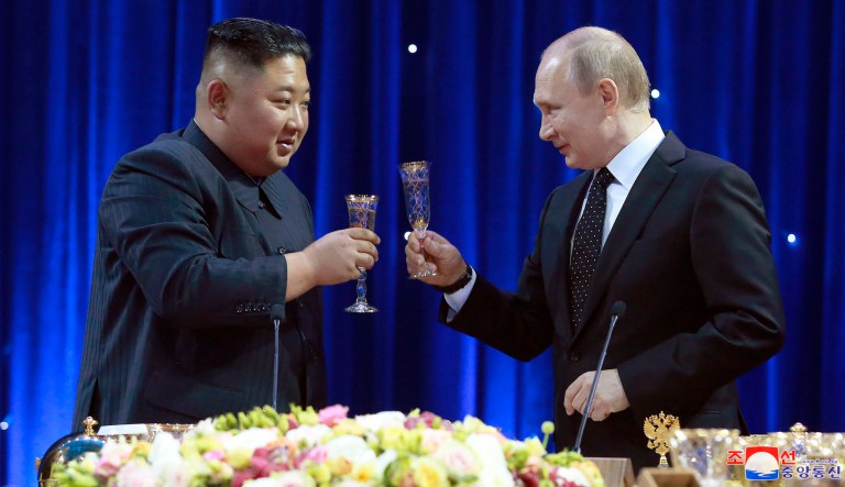 In this Thursday, April 25, 2019, photo provided by the North Korean government, North Korean leader Kim Jong Un, left, toasts with Russian President Vladimir Putin in Vladivostok, Russia. The content of this image is as provided and cannot be independently verified. Korean language watermark on image as provided by source reads: "KCNA" which is the abbreviation for Korean Central News Agency. 