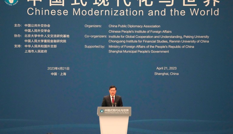 Chinese Foreign Minister Qin Gang gestures as he prepares to leave a press conference held on the sidelines of the annual meeting of China's National People's Congress in Beijing, Tuesday, March 7, 2023. 