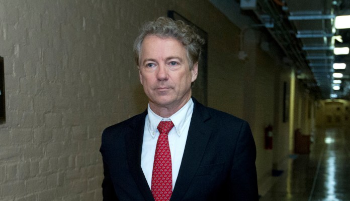 Sen. Rand Paul, R-Ky., walks to his office after speaking in the senate floor, at the Capitol, Thursday, Feb. 8, 2018, in Washington.