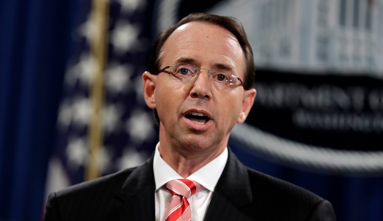 FILE - In this July 13, 2018, file photo, Deputy Attorney General Rod Rosenstein speaks during a news conference at the Department of Justice. Rosenstein is defending the prosecution of foreign agents who may never see the inside of a U.S. courtroom. He says the prosecutions of agents involved in efforts to sow dissent in the U.S. political system or in cyber-attacks serves as a deterrent even when they are beyond the reach of U.S. authorities.