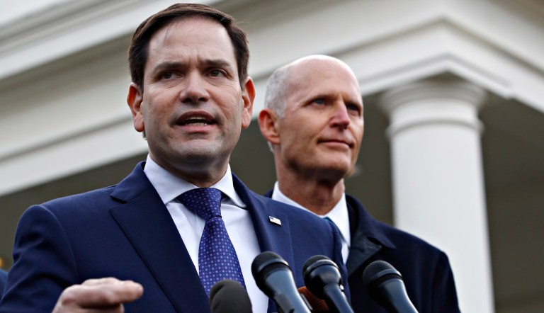 Sen. Marco Rubio, R-Fla., left, with Sen. Rick Scott, R-Fla., speaks to the media after their meeting with President Donald Trump about Venezuela, Tuesday, Jan. 22, 2019, at the White House in Washington. 