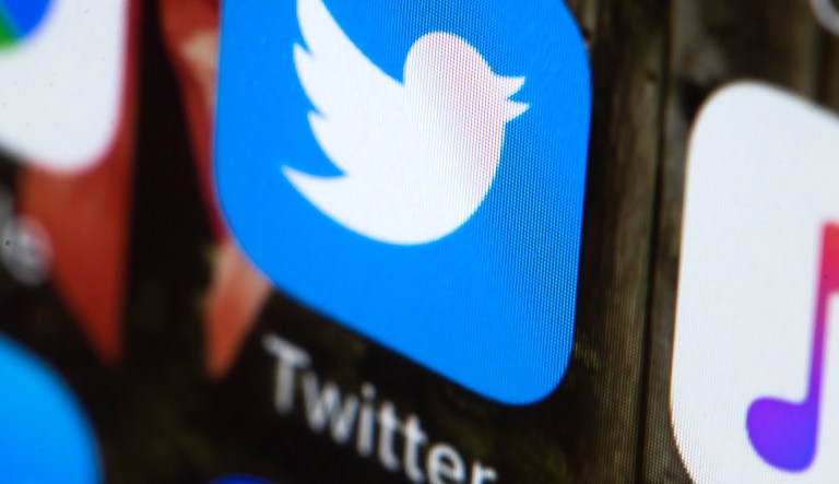 This Wednesday, April 26, 2017, photo shows the Twitter app on a mobile phone in Philadelphia. Twitter says it will ban ads from RT and Sputnik, two state-sponsored Russian news outlets that the U.S. intelligence community has said tried to interfere with the 2016 U.S. presidential election.