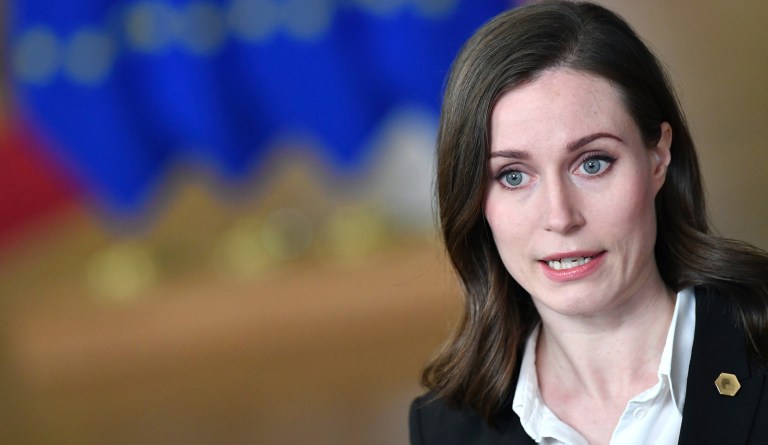 Former Finnish Prime Minister Sanna Marin speaks with the media as she arrives for an extraordinary EU summit on Ukraine at the European Council building in Brussels on Thursday, Feb 24, 2022. 
