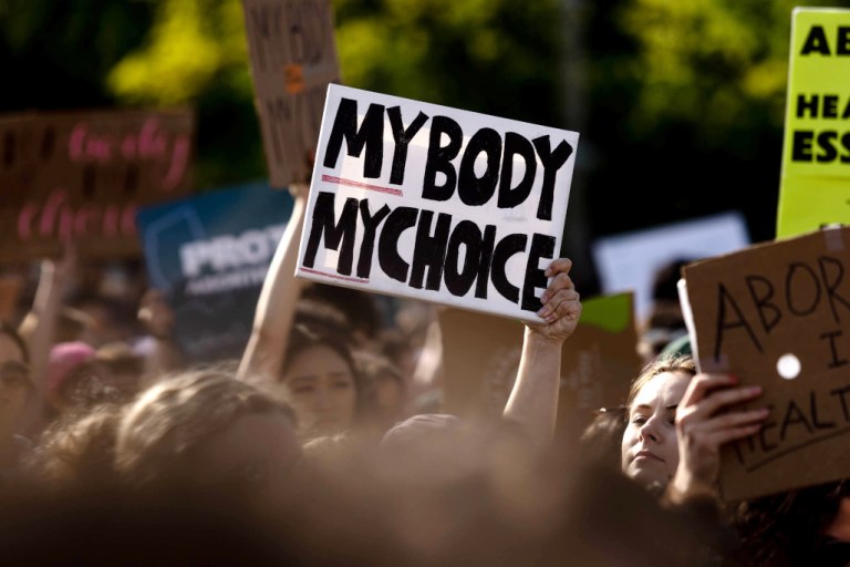 Abortion rights supporters gather in front of the Supreme Court in Washington after a Monday night leak of a draft decision that considered overturning Roe v. Wade.