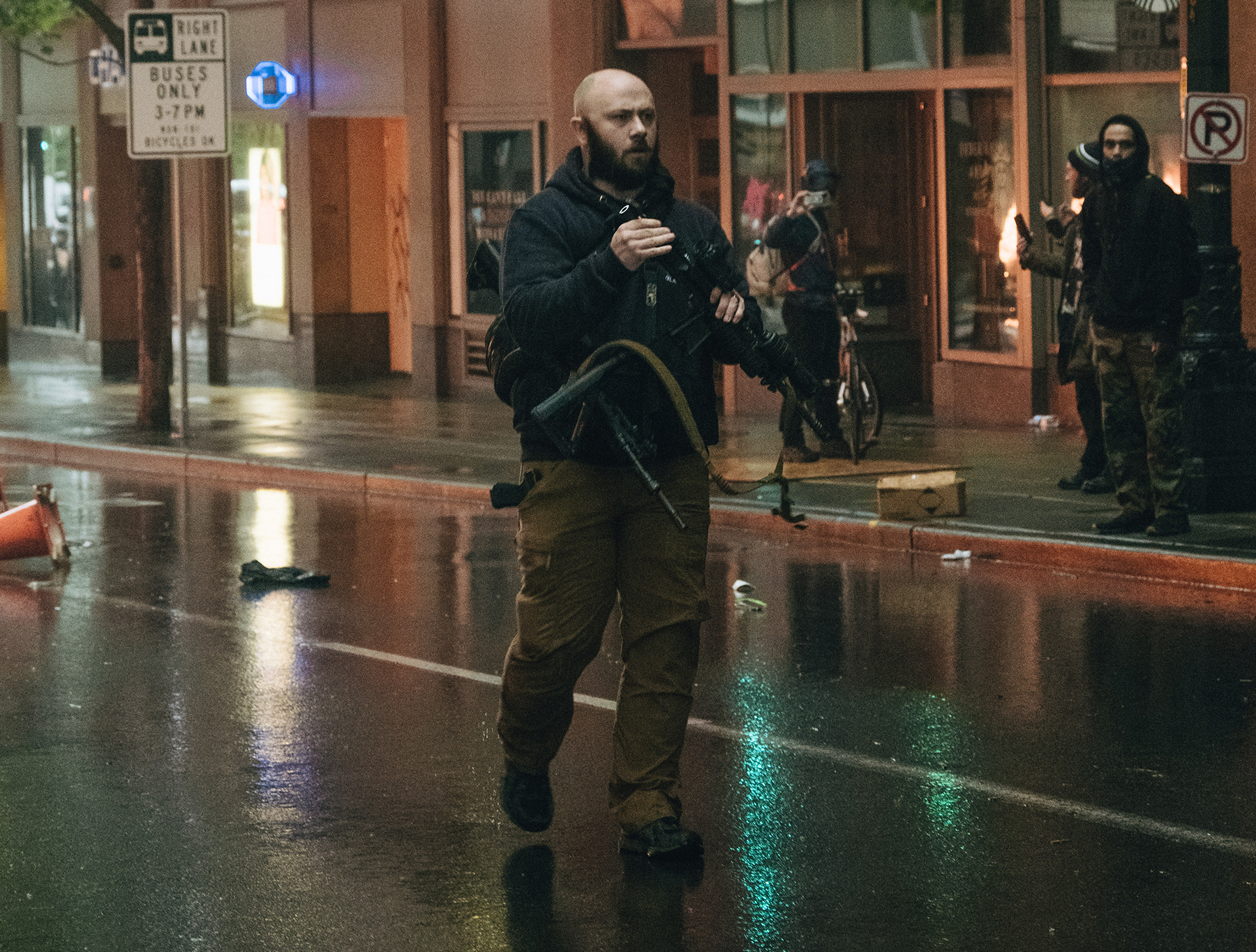 Private security guard disarms man who took rifle from police vehicle at Seattle protest