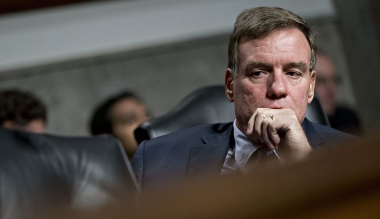 Sen. Mark Warner, D-Va., listens during a hearing in Washington, D.C., on Wednesday, Sept. 5, 2018.