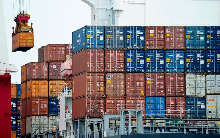 In this photo taken on Aug. 5, 2010, a container are being load into a cargo ship at the Tianjin port in China. China's exports grew strongly in July but import growth fell as its rapid economic expansion cooled, possibly hurting global demand. Exports rose 38.1 percent over a year ago to $145.5 billion while imports gained 22.7 percent to $116.8 billion, the customs agency reported Tuesday. Export growth eased from June's 43.9 percent rate while import growth tumbled from June's 34.1 percent expansion.