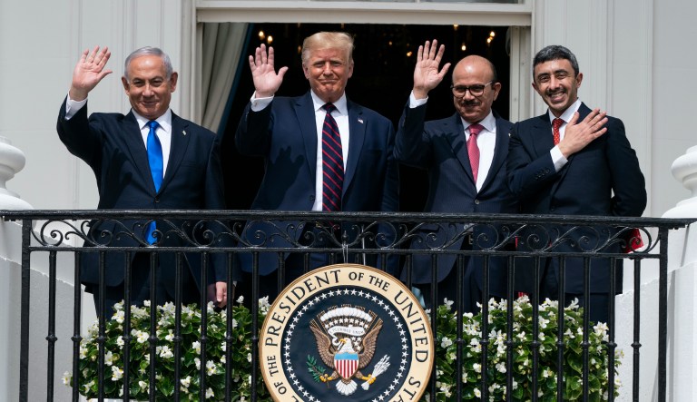 Israeli Prime Minister Benjamin Netanyahu, left, President Donald Trump, Bahrain Foreign Minister Khalid bin Ahmed Al Khalifa and United Arab Emirates Foreign Minister Abdullah bin Zayed al-Nahyan react on the Blue Room Balcony after signing the Abraham Accords during a ceremony on the South Lawn of the White House, Tuesday, Sept. 15, 2020, in Washington.