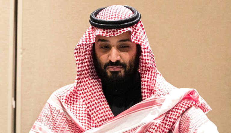 Mohammed bin Salman, Saudi Arabia's crown prince, signs an agreement with SoftBank Group Corp. Chairman Masayoshi Son in New York on Tuesday, March 27, 2018.