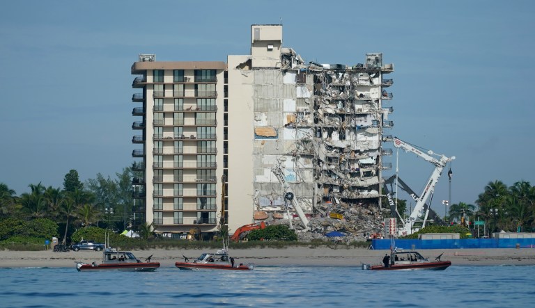 U.S. Coast Guard boats patrol in front of the partially collapsed Champlain Towers South condo building, ahead of a planned visit to the site by President Joe Biden, on Thursday, July 1, 2021, in Surfside, Fla. Rescue efforts at the site of the partially collapsed condominium building were halted Thursday out of concern about the stability of the remaining structure, officials said.