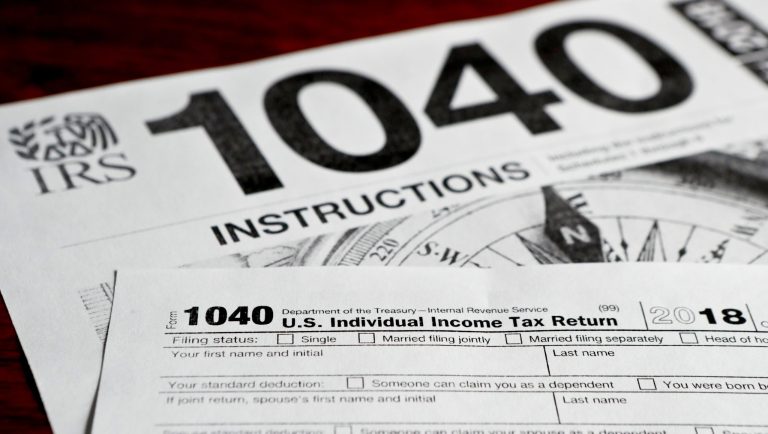 This photo made on Wednesday, Feb. 13, 2019, in Zelienople, Pa., shows multiple forms printed from the Internal Revenue Service web page that are used for 2018 U.S. federal tax returns. 