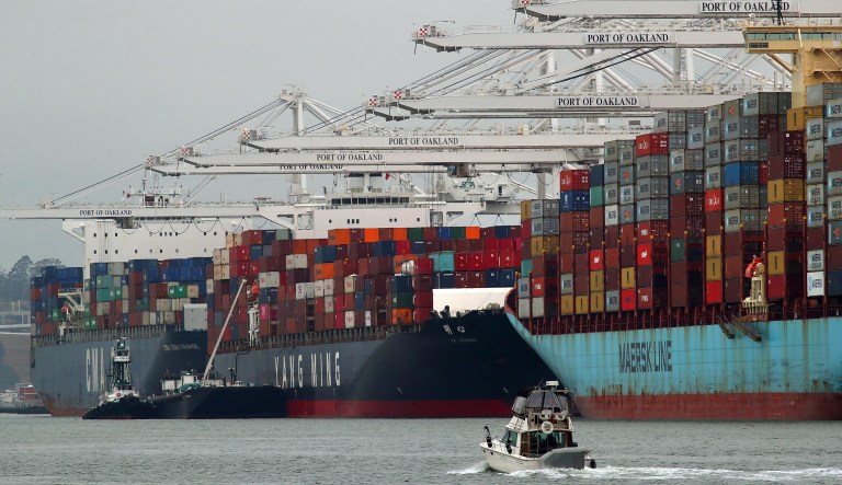 Container ships are unloaded at the Port of Oakland on Monday, July 2, 2018, in Oakland, Calif. 