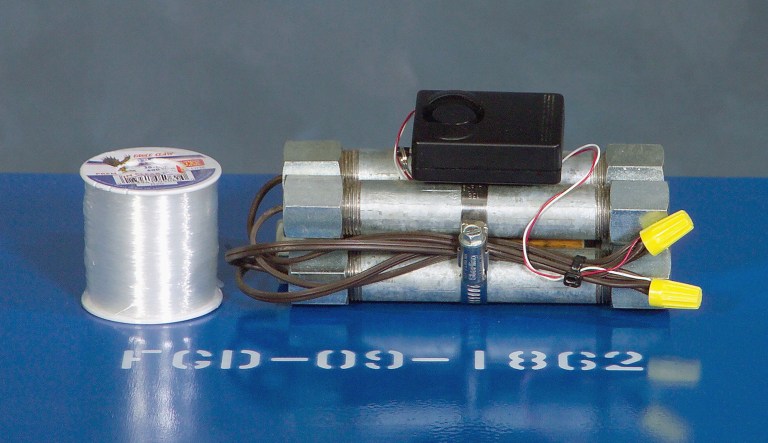 This trip wire pipe bomb improvised explosive device (IED) simulator, used to train US military service personnel, is displayed in the US Army (USA) Training Support Center (TSC), USA Signal Command and Fort Gordon (USASC & FG), Fort Gordon, Georgia (GA).