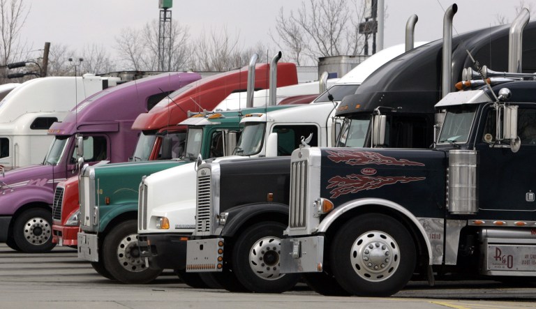 In this Monday, Jan. 30, 2006 file photo, trucks park at a truck stop  in Franklin, Ohio.
