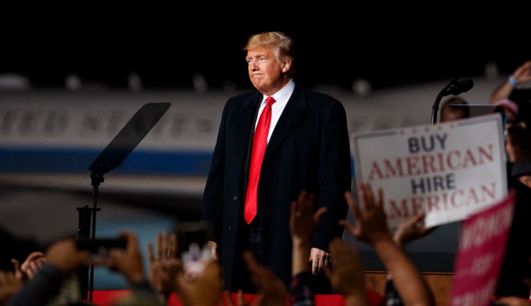 President Donald Trump looks the the cheering audience as he leaves a campaign rally at Minuteman Aviation Hangar, Thursday, Oct. 18, 2018, in Missoula, Mont.