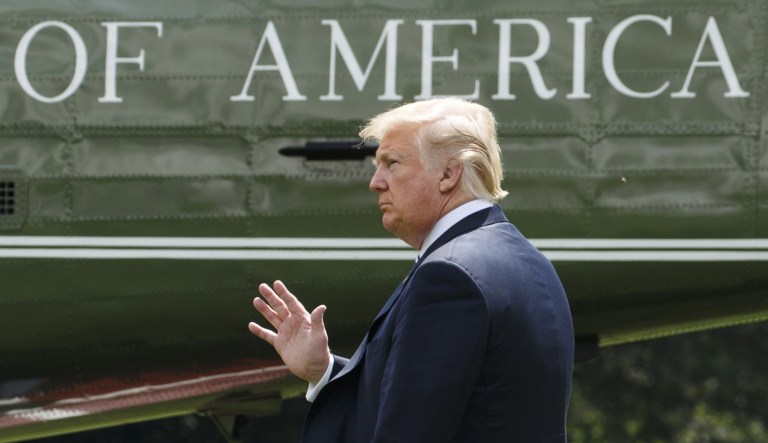 U.S. President Donald Trump waves before boarding Marine One in Washington, D.C., U.S., on Friday, Aug. 31, 2018.