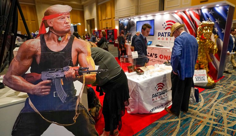 A cardboard cutout of Donald Trump is seen at a booth at a trade show at the Conservative Political Action Conference (CPAC) Friday, Feb. 25, 2022, in Orlando, Florida.