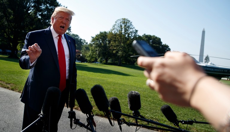 President Donald Trump talks with reporters before departing for an event to celebrate the 400th anniversary celebration of the first representative assembly at Jamestown, on the South Lawn of the White House, Tuesday, July 30, 2019, in Washington.