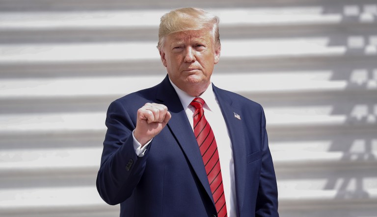 President Donald Trump gestures towards members on the media on the South Lawn of the White House in Washington, Thursday, Sept. 26, 2019, after returning from United Nations General Assembly.