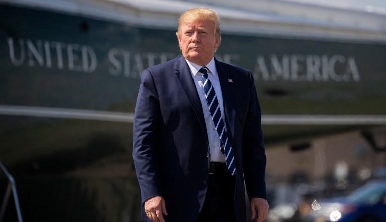 In this Sunday, July 21, 2019 file photo, President Donald Trump walks on the tarmac to board Air Force One at Morristown Municipal Airport, in Morristown, N.J.