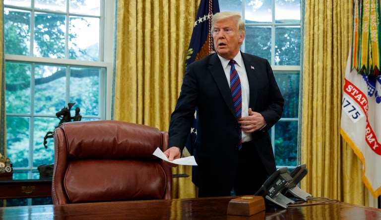 President Trump arrives for a phone call with Mexican President Enrique Pena Nieto about a trade agreement between the United States and Mexico in the Oval Office, Monday, Aug. 27, 2018.