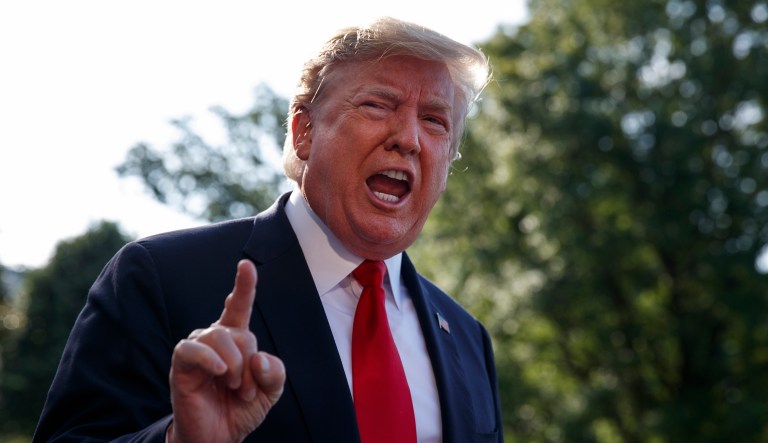President Donald Trump talks with reporters before departing on Marine One for the Air Force Academy graduation ceremony, Thursday, May 30, 2019, in Washington.