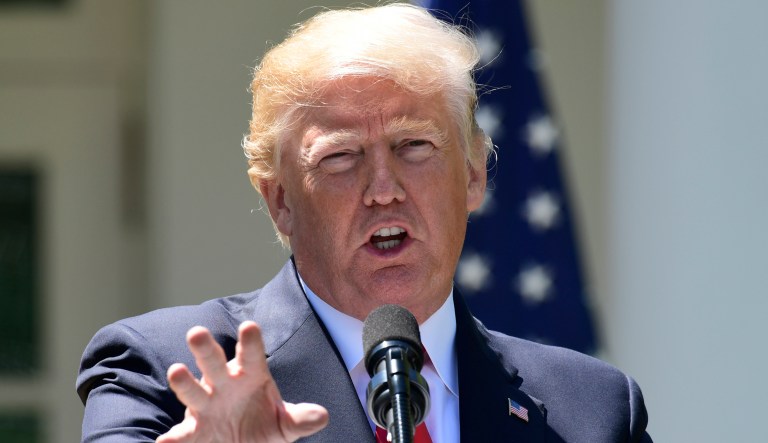 President Donald Trump speaks during a news conference with Nigerian President Muhammadu Buhari in the Rose Garden of the White House in Washington, Monday, April 30, 2018.