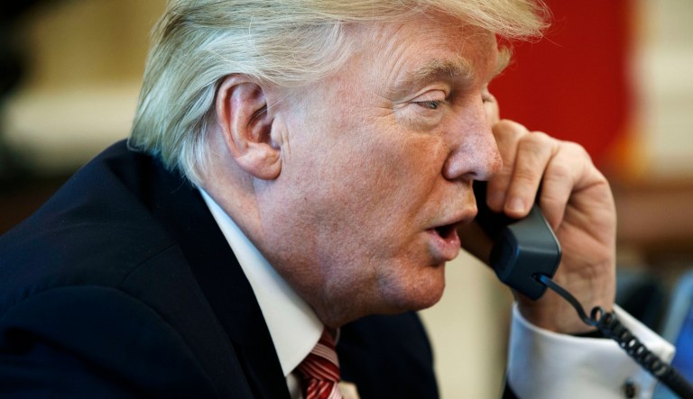 In this June 27, 2017, file photo, President Donald Trump talks on the telephone in the Oval Office of the White House in Washington. Trump's request of a âfavorâ from Ukrainian President Volodymr Zelensk, in the now infamous July 25, 2019 phone call in a line that helped to launch the impeachment process, tops a Yale Law School librarian's list of the most notable quotes of 2019.