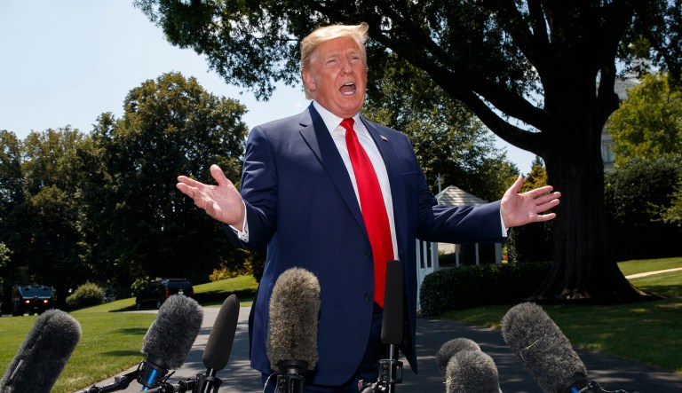 President Donald Trump speaks to media as he arrives at the White House in Washington, Tuesday, July 30, 2019, as the returns from Virginia.